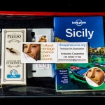 Our Sicily Survival Kit for our guests from San Antonio, TX. Modica’s chocolate, our Guests’ cell phone, Guide to Sicily and map of Aci Sant’Antonio
