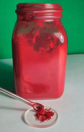 The powder pigment is deposited on an IR transparent window.
